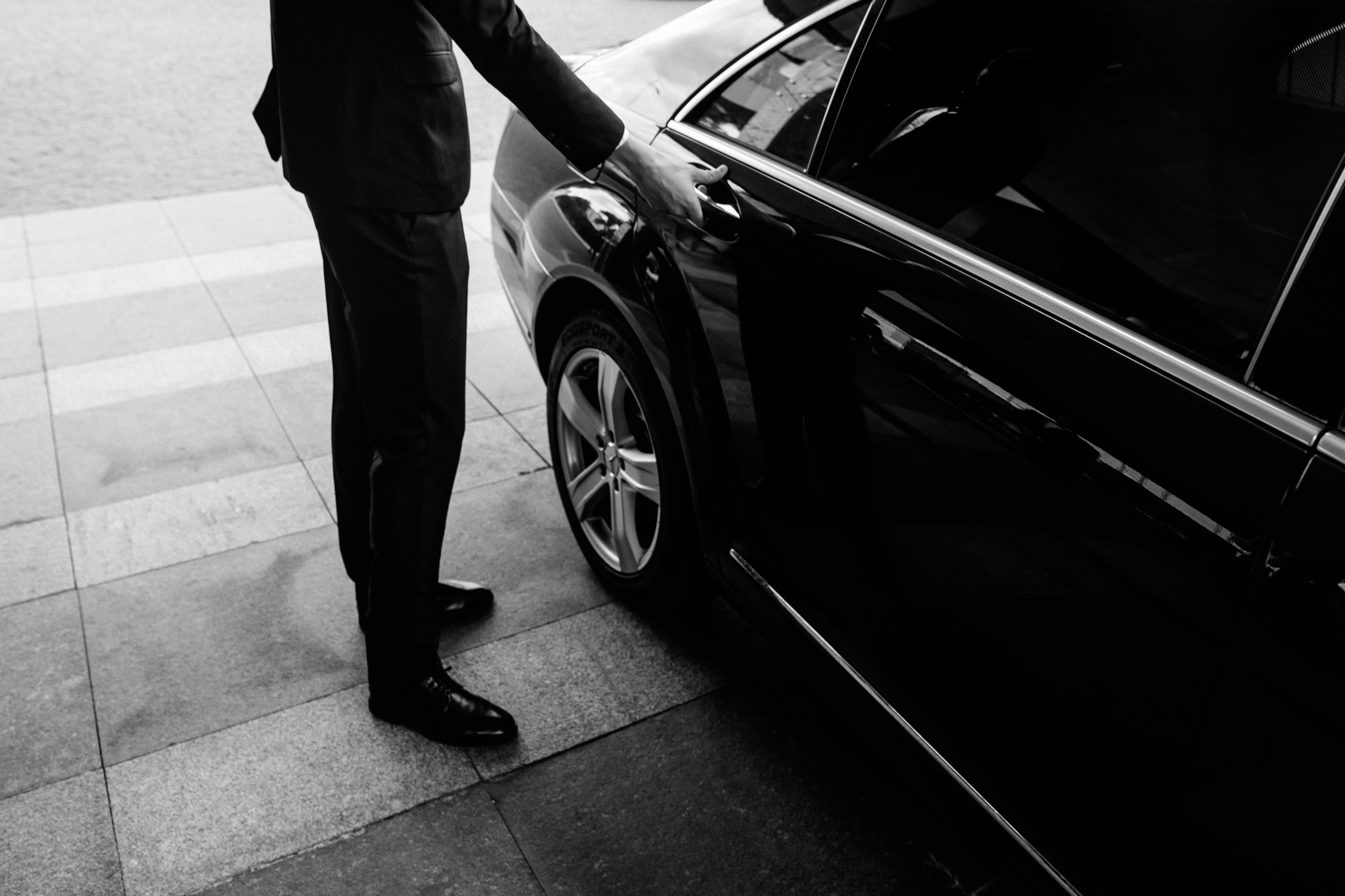 KNY Limo chauffeur opening car door
